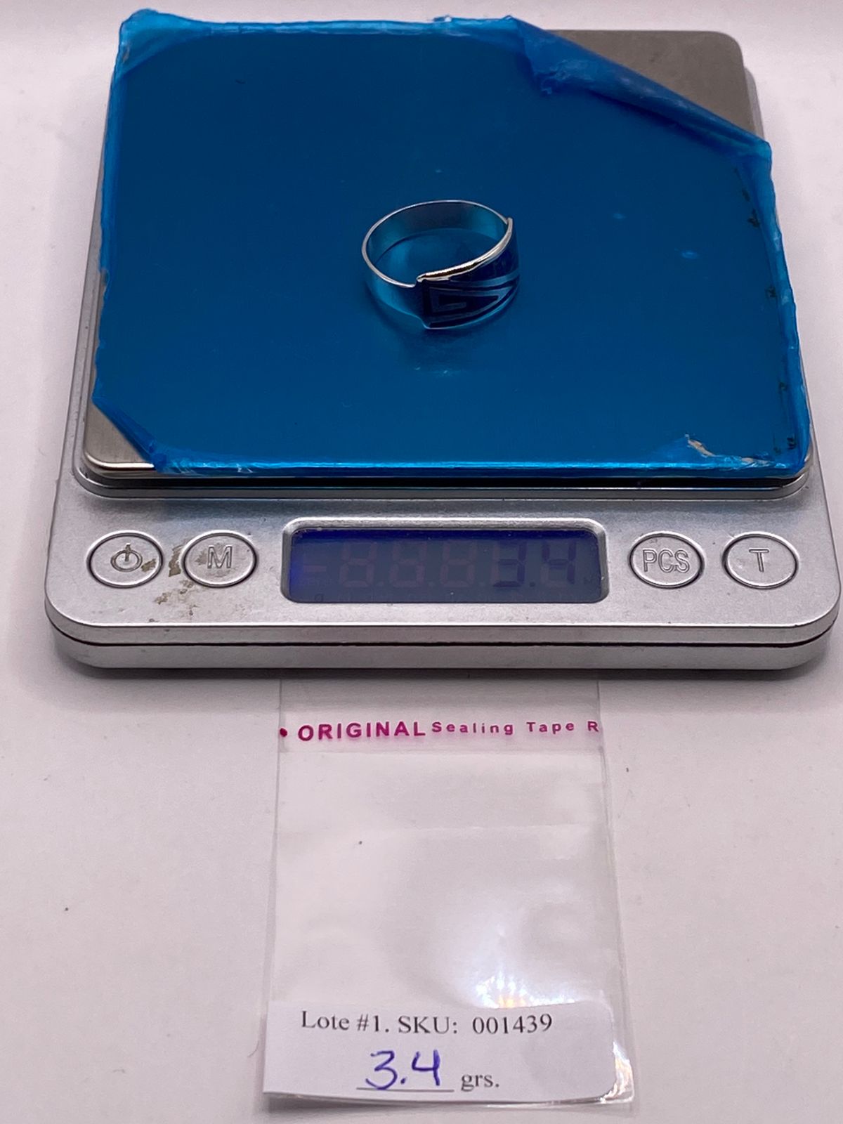 ANILLO GRECA CONTEMPORÁNEO DE PLATA LEY 950 CON ÓPALO DE FUEGO
