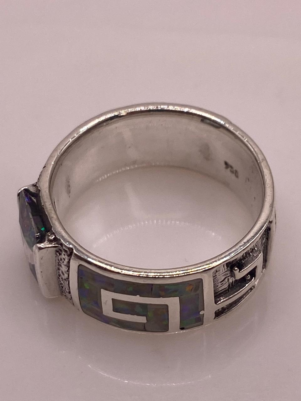 ANILLO GRECA CON ÓPALO DE FUEGO Y ZIRCONIA EN PLATA LEY .950