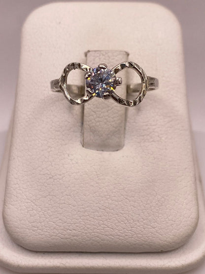 Anillo Infinito con Zirconia Brillante en Plata Ley 925, sello de autenticidad Plata Ley .925