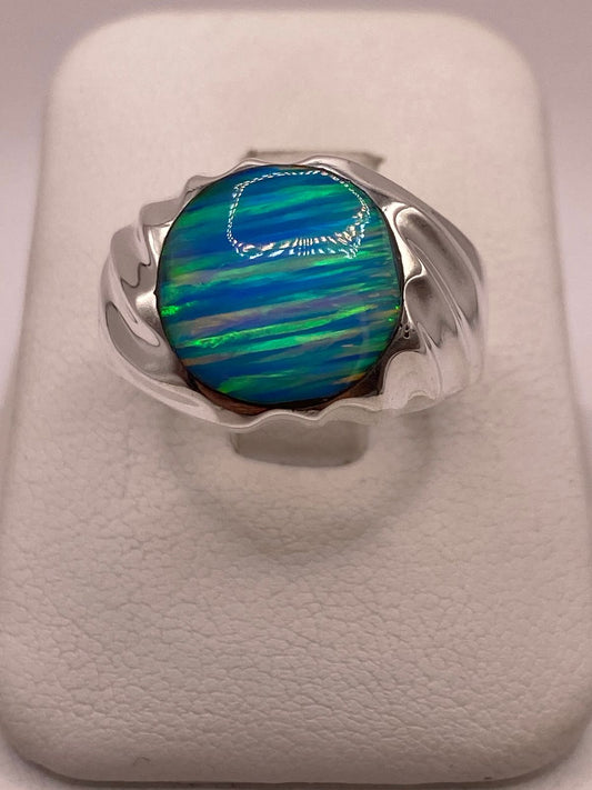 AANILLO CON ÓPALO DE FUEGO AZUL CELESTE IRIDISCENTE EN PLATA LEY .950