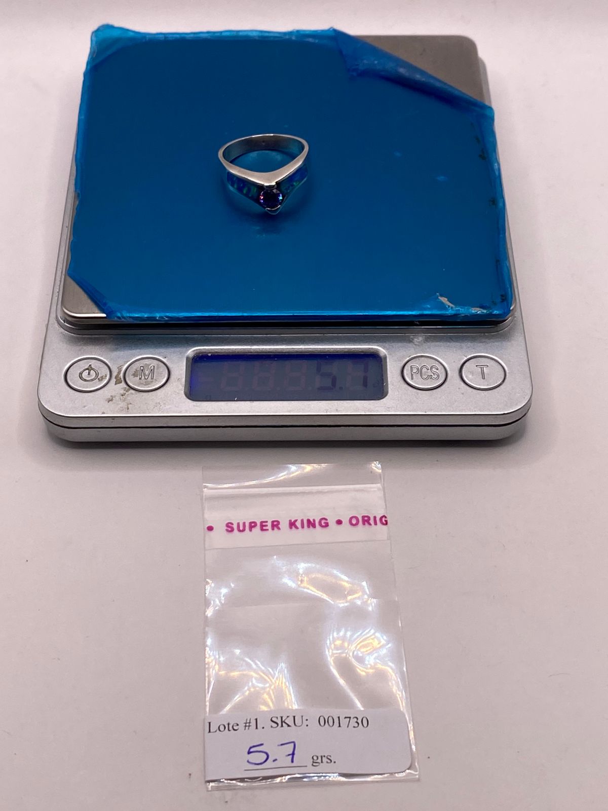 ANILLO DE PLATA LEY 9250 CON ÓPALO DE FUEGO Y ZIRCONIA MORADA