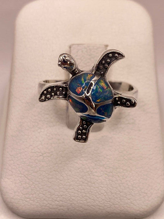 ANILLO TORTUGA MARINA EN PLATA LEY 950 CON ÓPALO DE FUEGO🐢