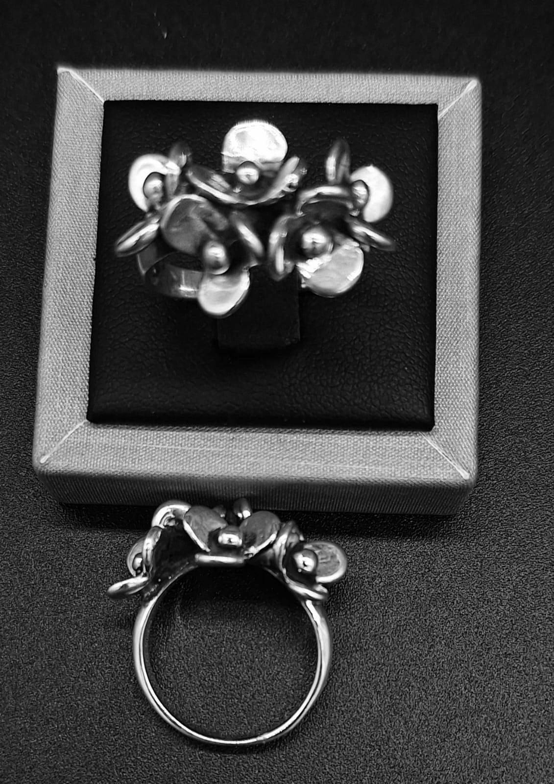 ANILLO FLORES EN  PLATA LEY 925