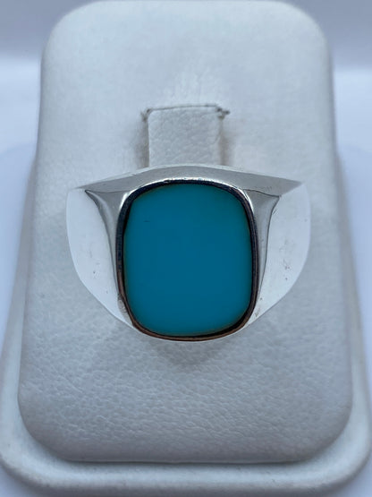 Anillo de plata .925 con piedra azul cielo engastada en marco de plata