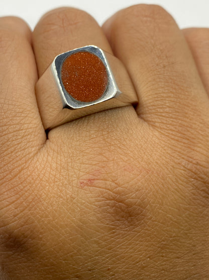 Anillo sobre fondo gris con certificado de autenticidad .925