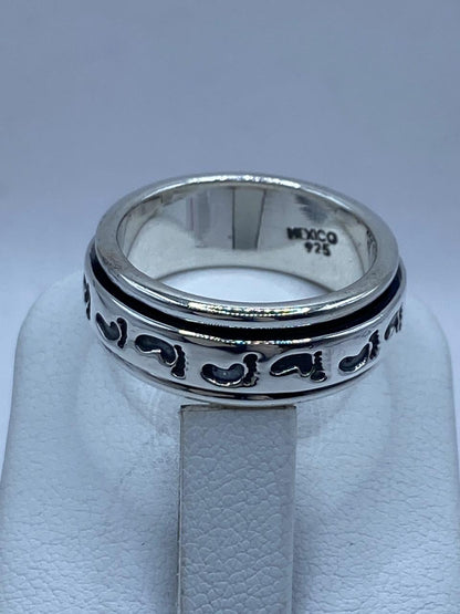Anillo Giratorio de Plata 925 con Huellas, sello de autenticidad Plata Ley .925