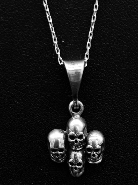 DIJE PLATA LEY 925 , DE CUATRO CRANEOS